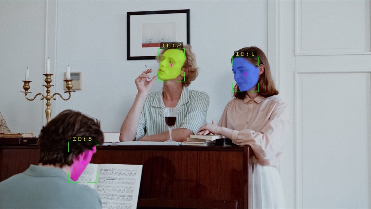 Three faces detected with per-face outlines