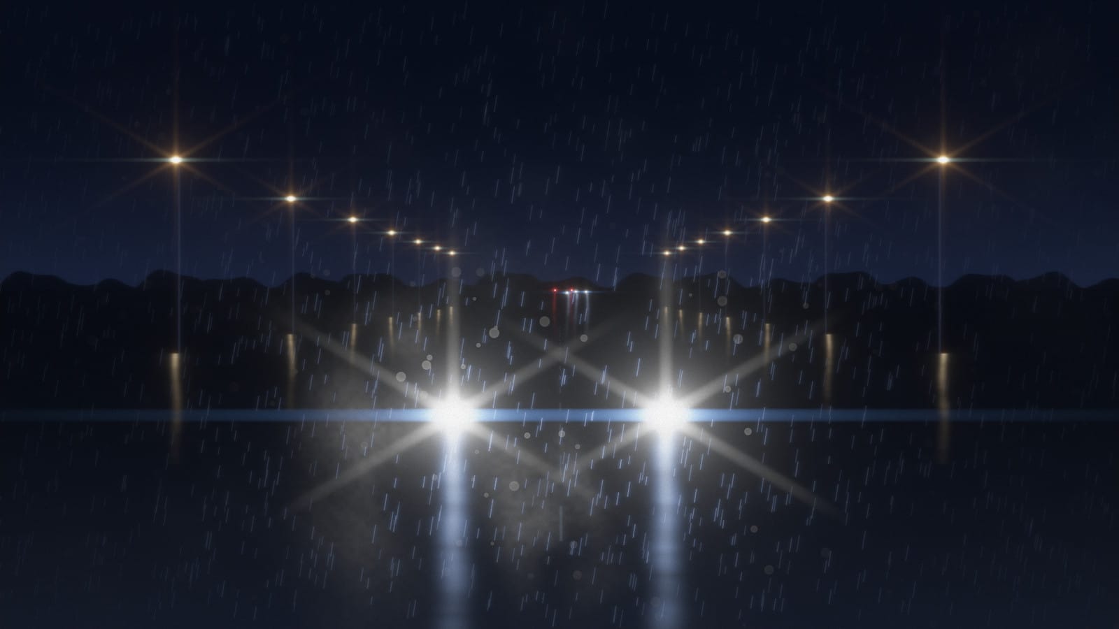 Headlights in the rain with blue anamorphic streaks and starbursts on the street lamps